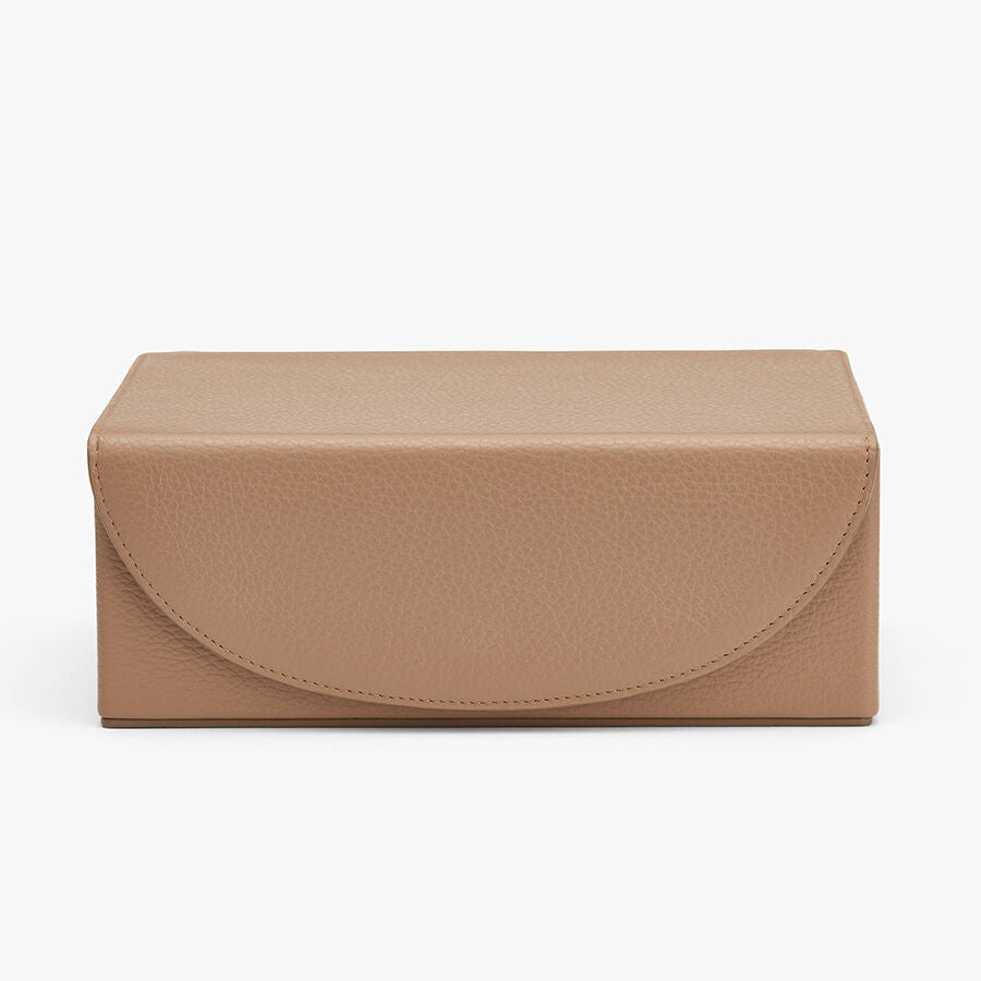 Rectangular clutch bag with flap closure on a plain background.