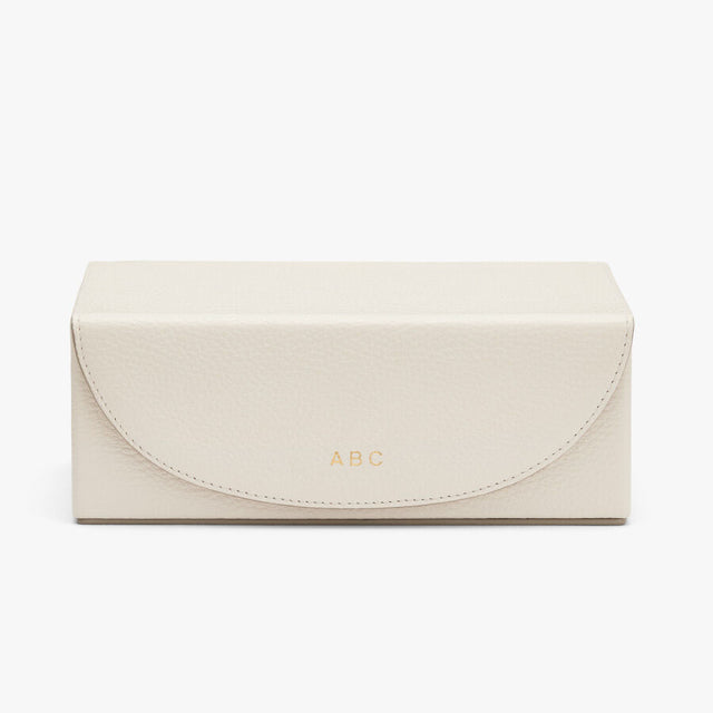 Rectangular box with a flap closure and embossed letters 'ABC'
