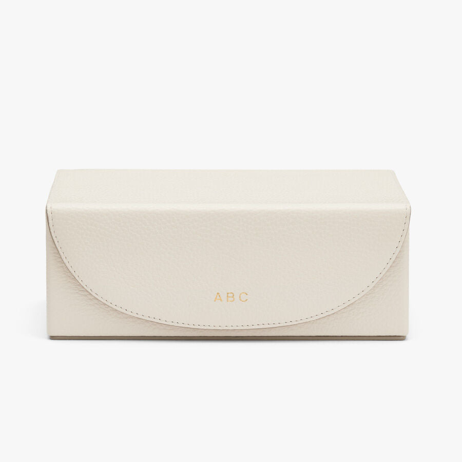 Rectangular box with a flap closure and embossed letters 'ABC'