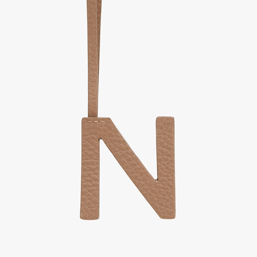Letter N hanging by a strap