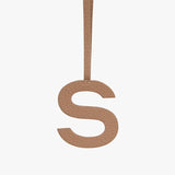 Letter S hanging from a string