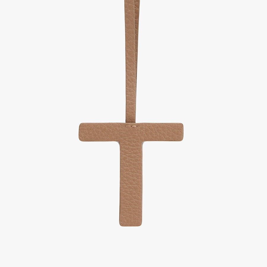 Cross pendant hanging vertically