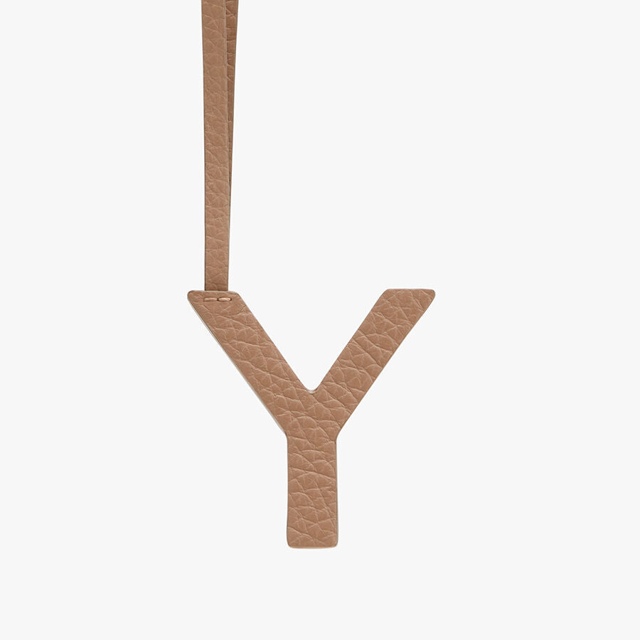 Letter Y hanging by a strap