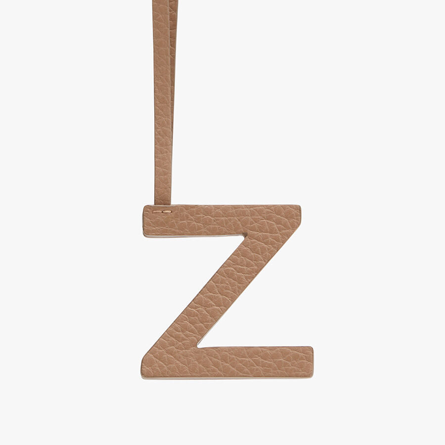 Letter Z hanging from a strap