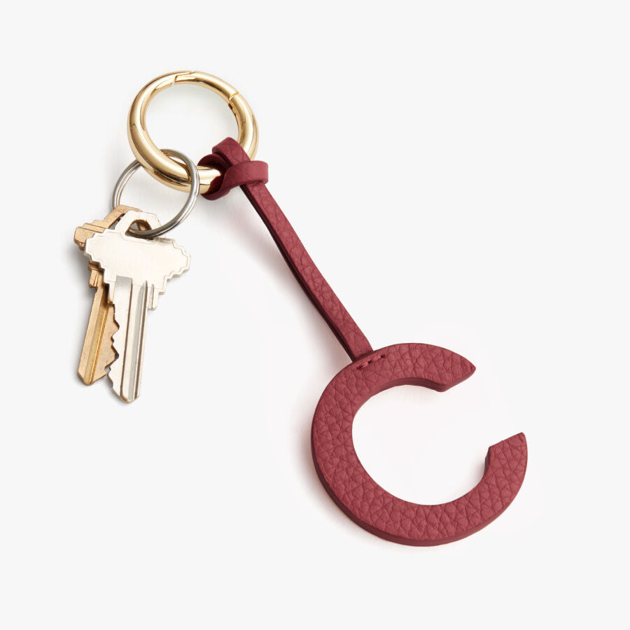 Keychain with letter C charm and keys attached.