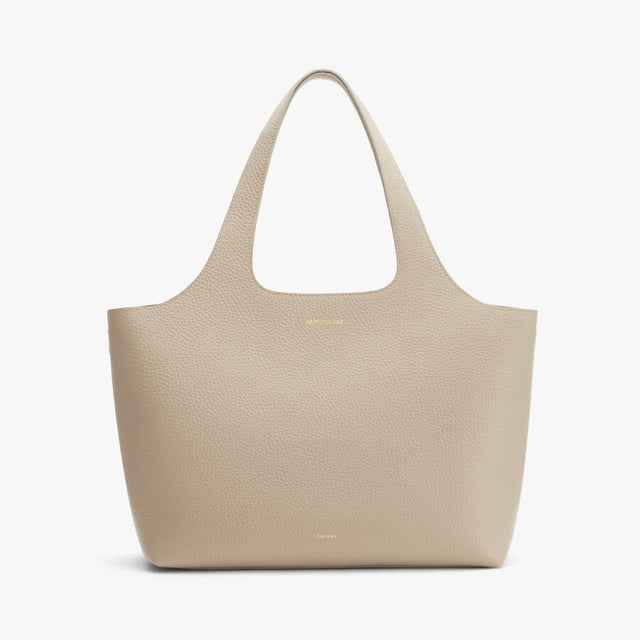 Textured tote bag with two handles and a brand logo on the front.