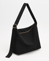 Shoulder bag with adjustable strap and buckle closure