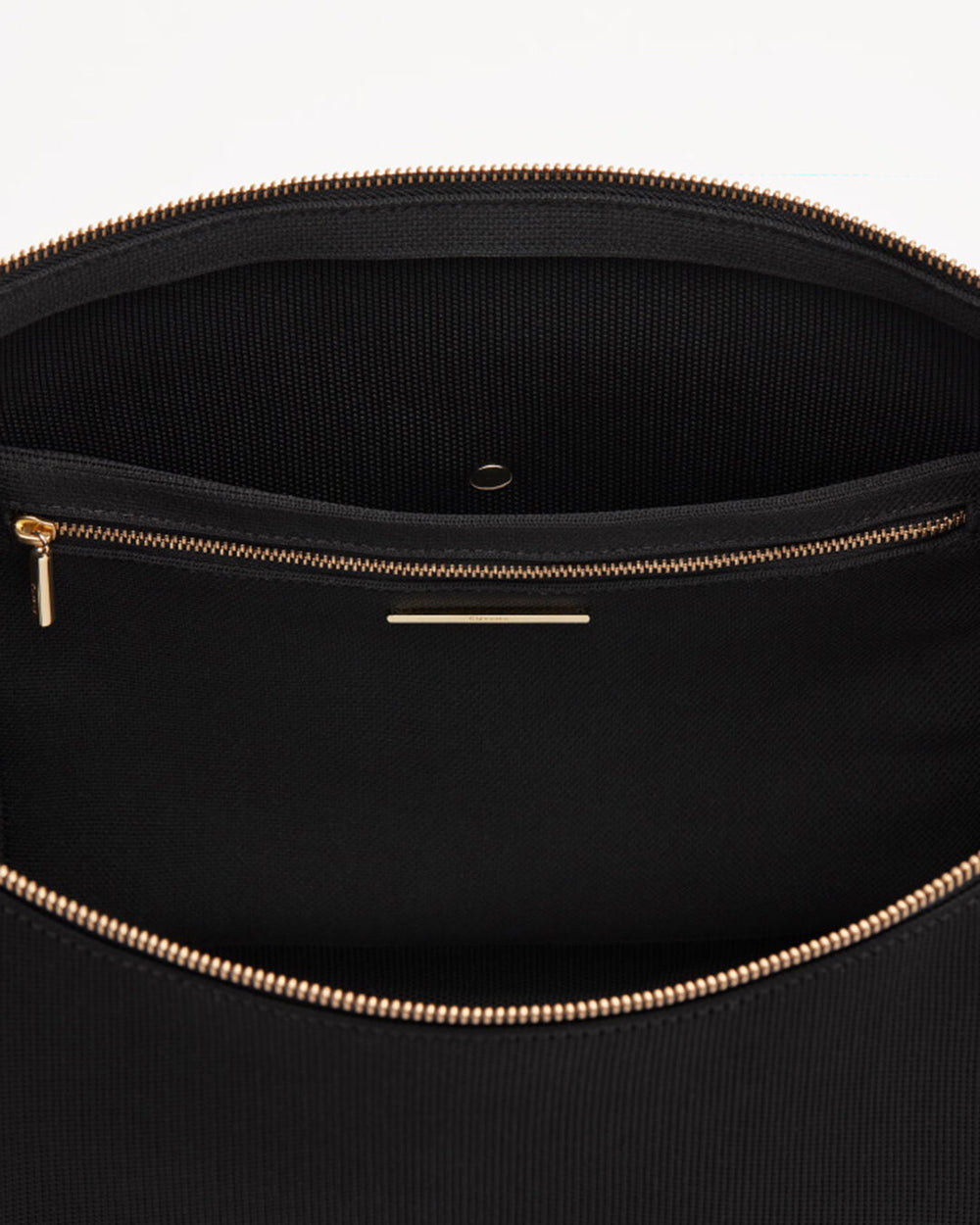 Close-up of an open bag with a zipper.