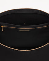 Close-up of an open bag with a zipper.