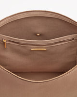 Open bag showing interior compartments and zippers.