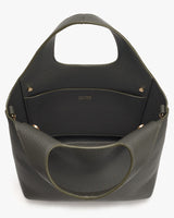 Leather handbag with front pocket and shoulder strap.