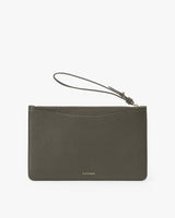 Small wristlet clutch with a zipper and a wrist strap.