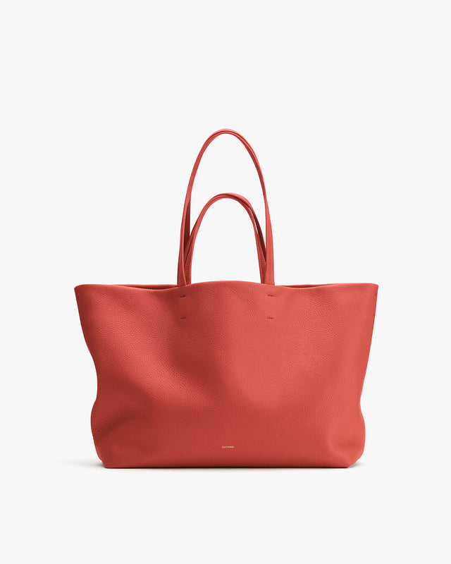 Large tote bag with two handles standing upright.