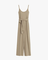 Sleeveless jumpsuit with a tie at the waist and wide legs.