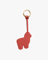 Keychain with an alpaca-shaped pendant attached to a ring by a strap.