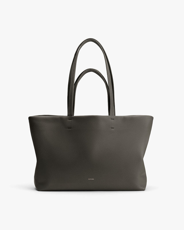 Large tote bag with two handles standing upright.