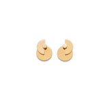 Two round stud earrings on a plain background