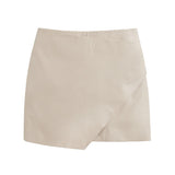 Skirt with an asymmetric hemline on a plain background.