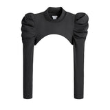 Black top with puffy sleeves and a round neckline displayed on a plain background.