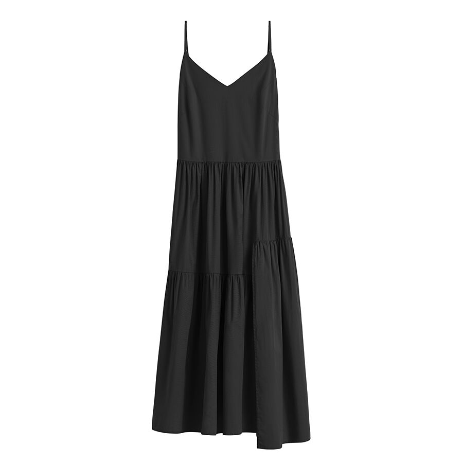 Sleeveless dress with V-neckline and tiered skirt.