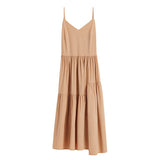 Sleeveless dress with V-neckline and tiered skirt.
