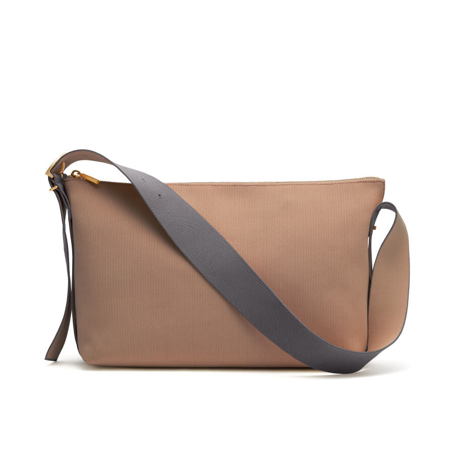 Shoulder bag with a long strap on a white background