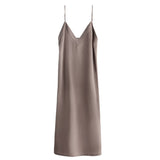 Sleeveless dress with thin straps and V-neckline on plain background.
