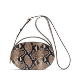 Patterned small handbag with a long strap and a zipper.