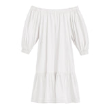 Off-shoulder dress with three-quarter sleeves and ruffled hem.