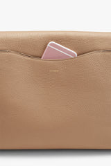 Smartphone peeking out from a bag's pocket.