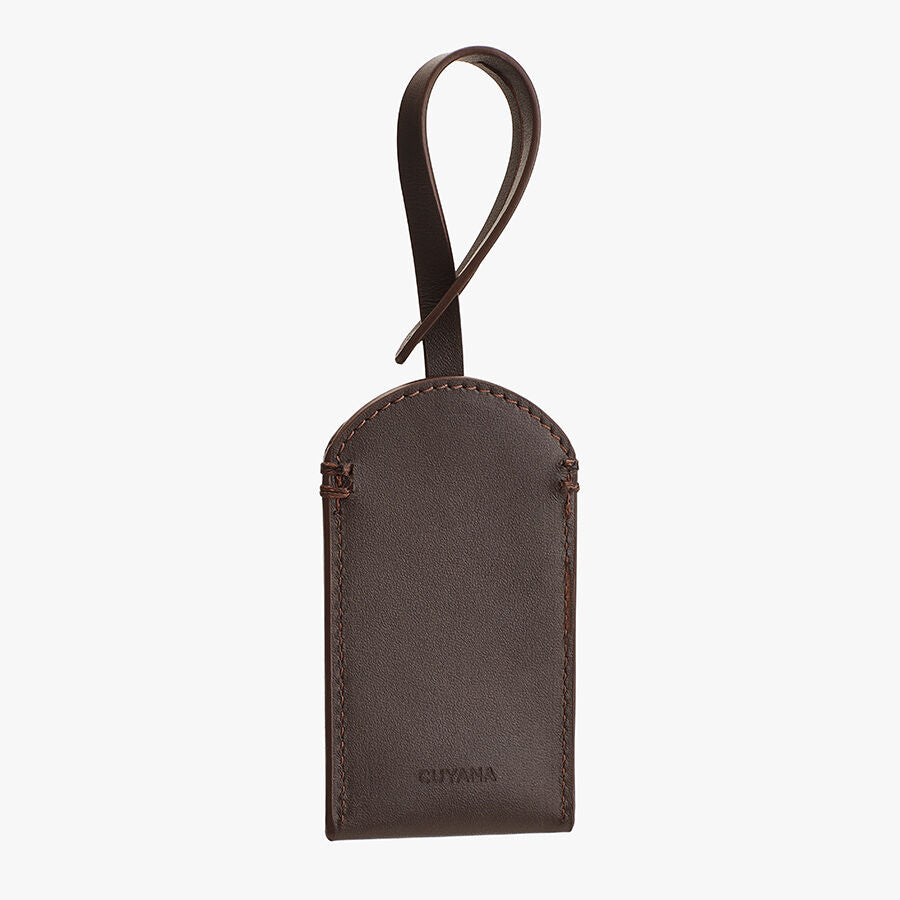 Leather Luggage Tag Leather luggage tag with loop handle and stitched edges.