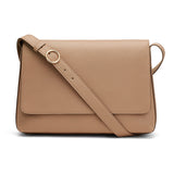 Crossbody bag with a flap closure and an adjustable strap.