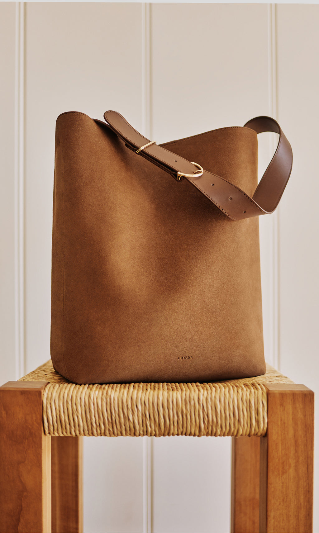 A large tote bag on a wooden chair.