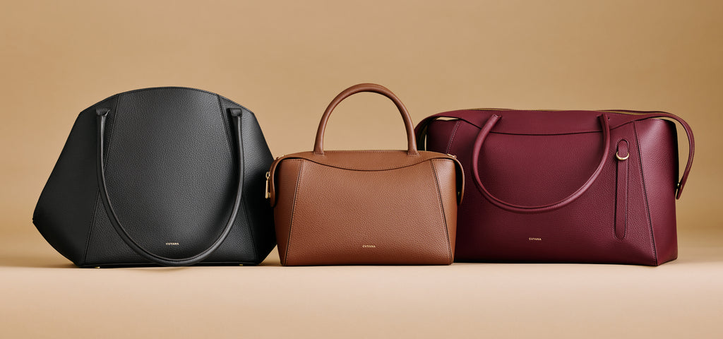 Three handbags arranged side by side on a plain background.
