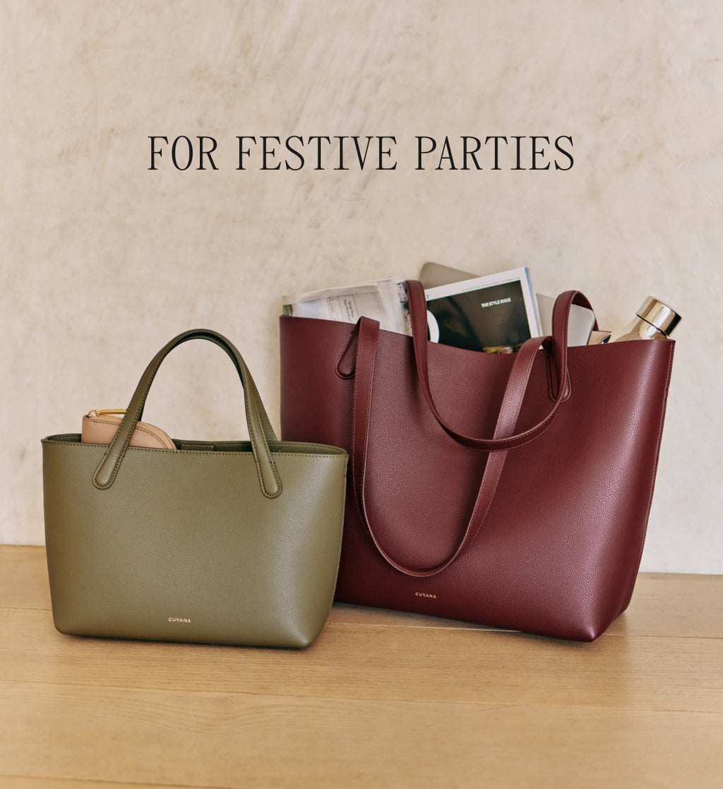Two handbags on a wooden surface with items inside.