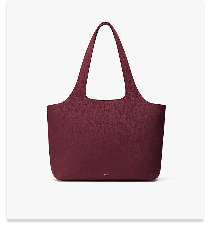 Tote bag with wide straps displayed against a plain background.