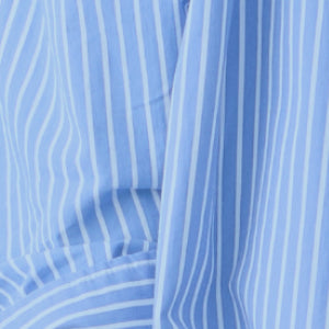 Close-up of a striped fabric with vertical and diagonal lines.