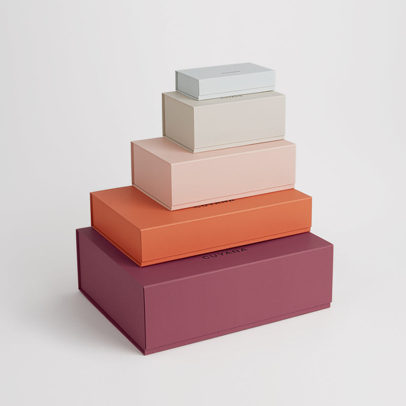 Stack of four rectangular boxes of varying sizes.