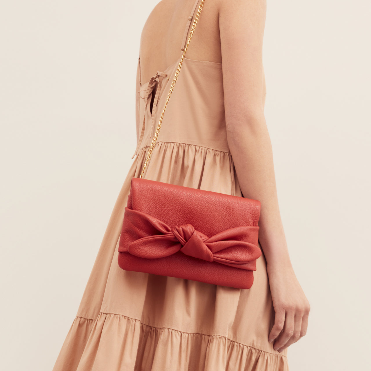 TIED WITH A BOW CLUTCH -GOLD – Dear Stella Boutique