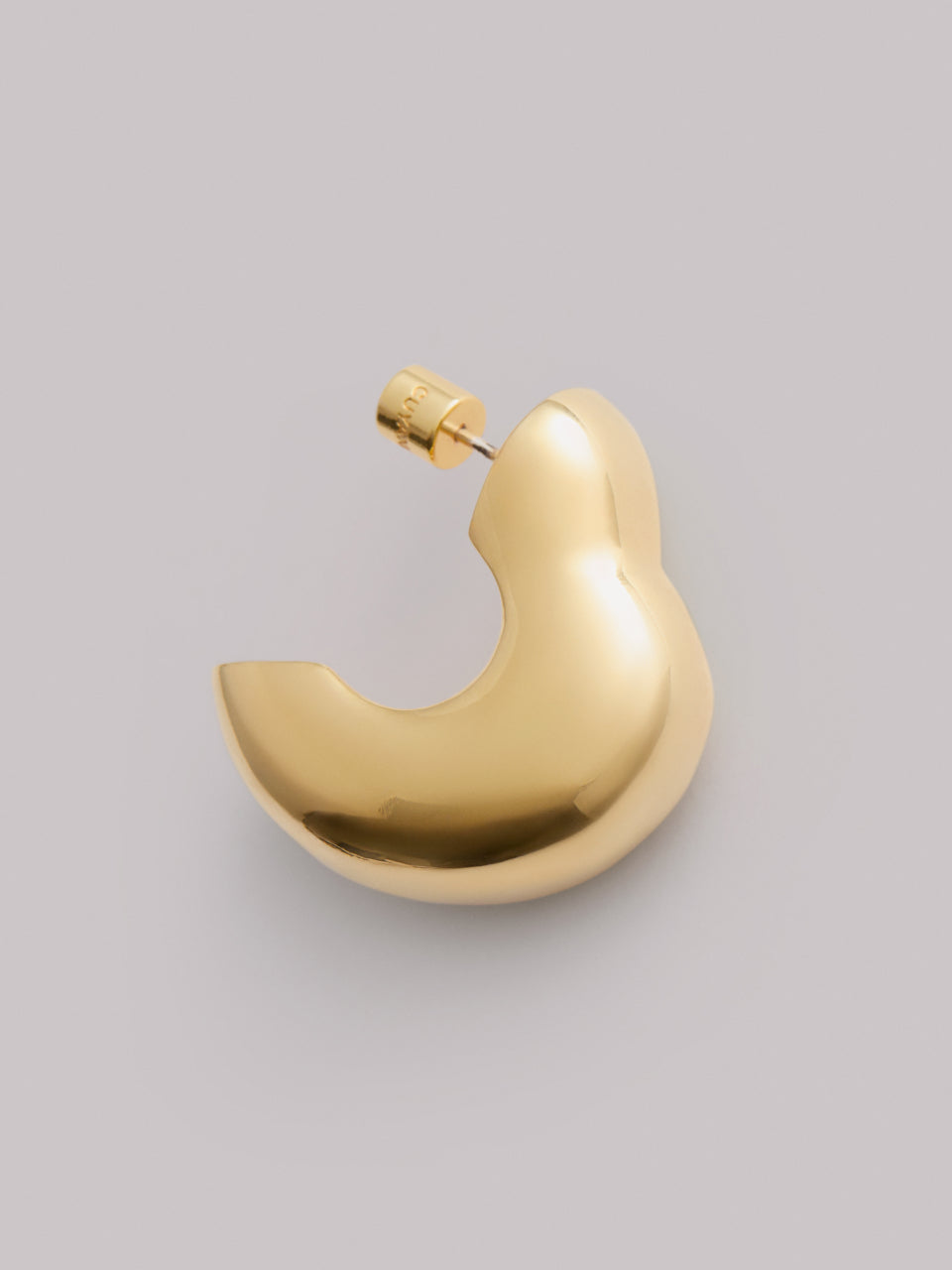 Curved metal earring with a smooth surface