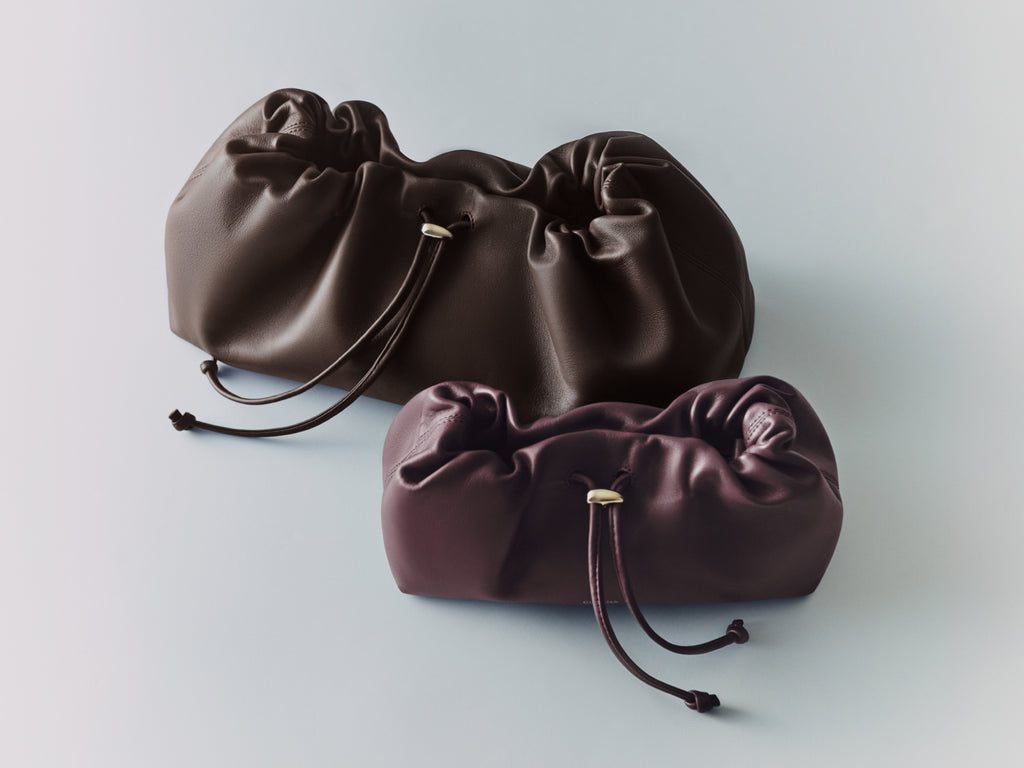 Two drawstring pouches on a plain background.
