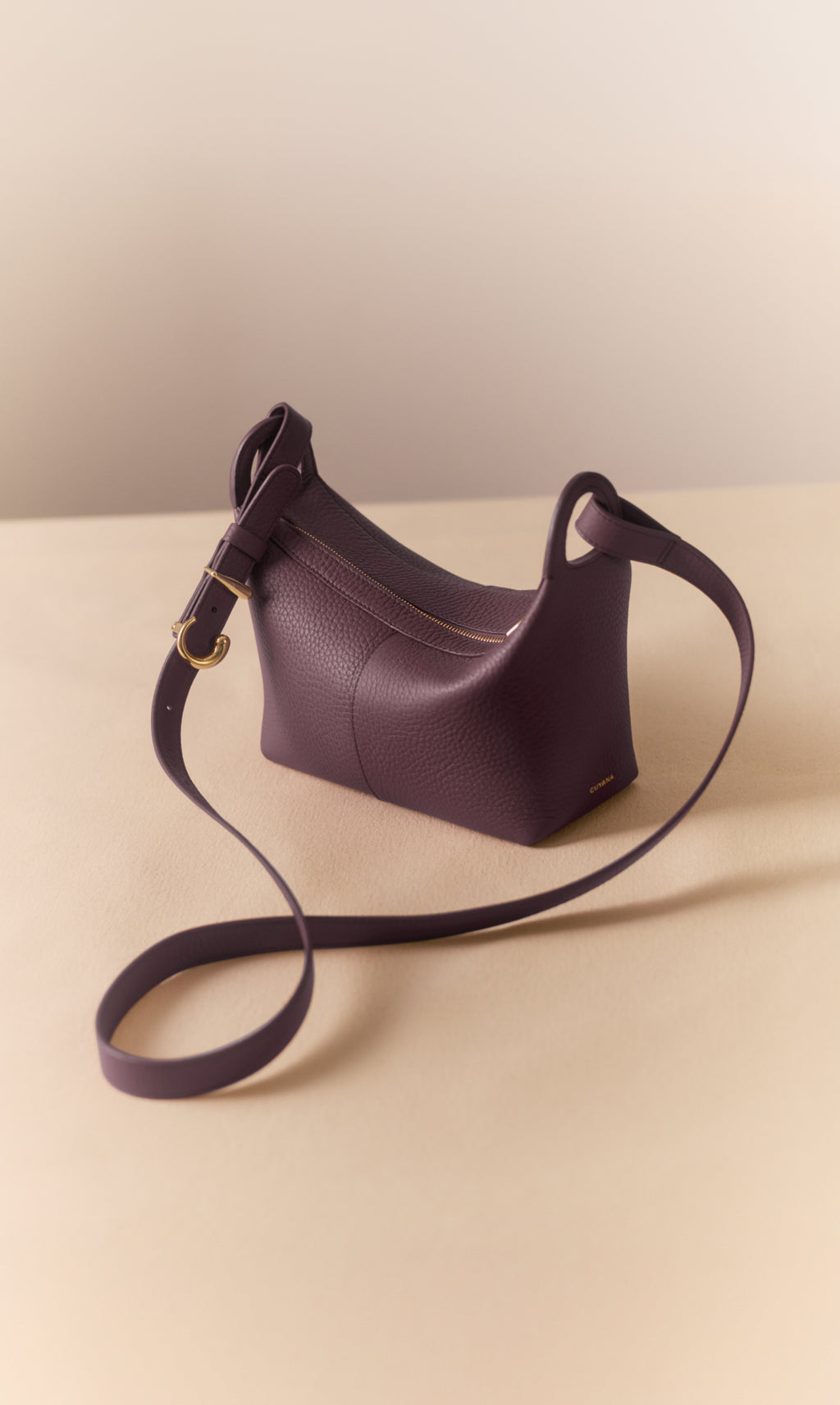 Crossbody bag on a flat surface