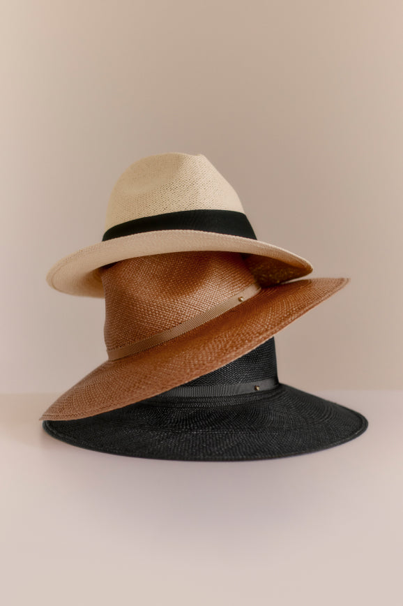 Three hats stacked on top of each other.