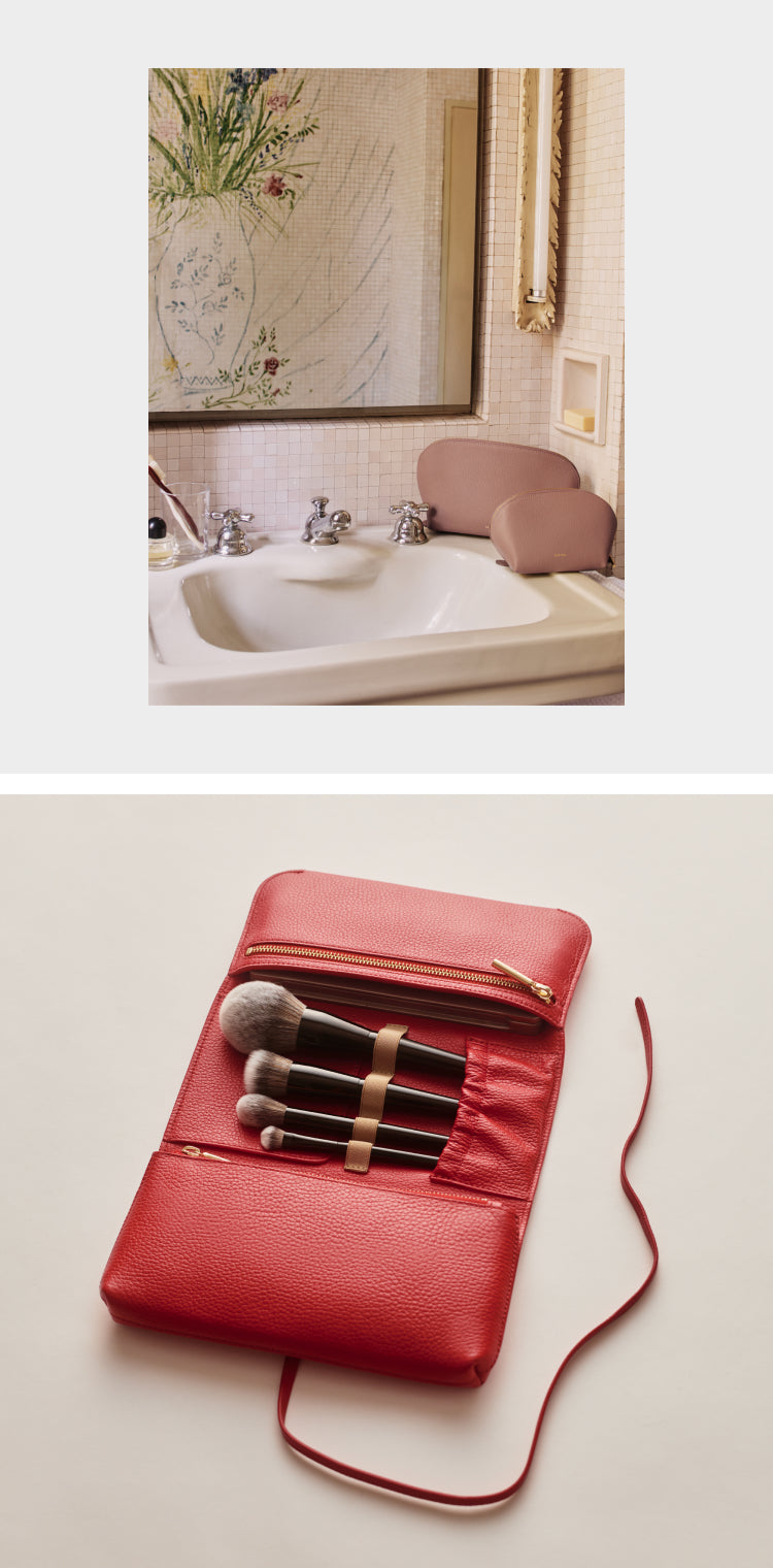 Bathroom with a sink and a red pouch with brushes.