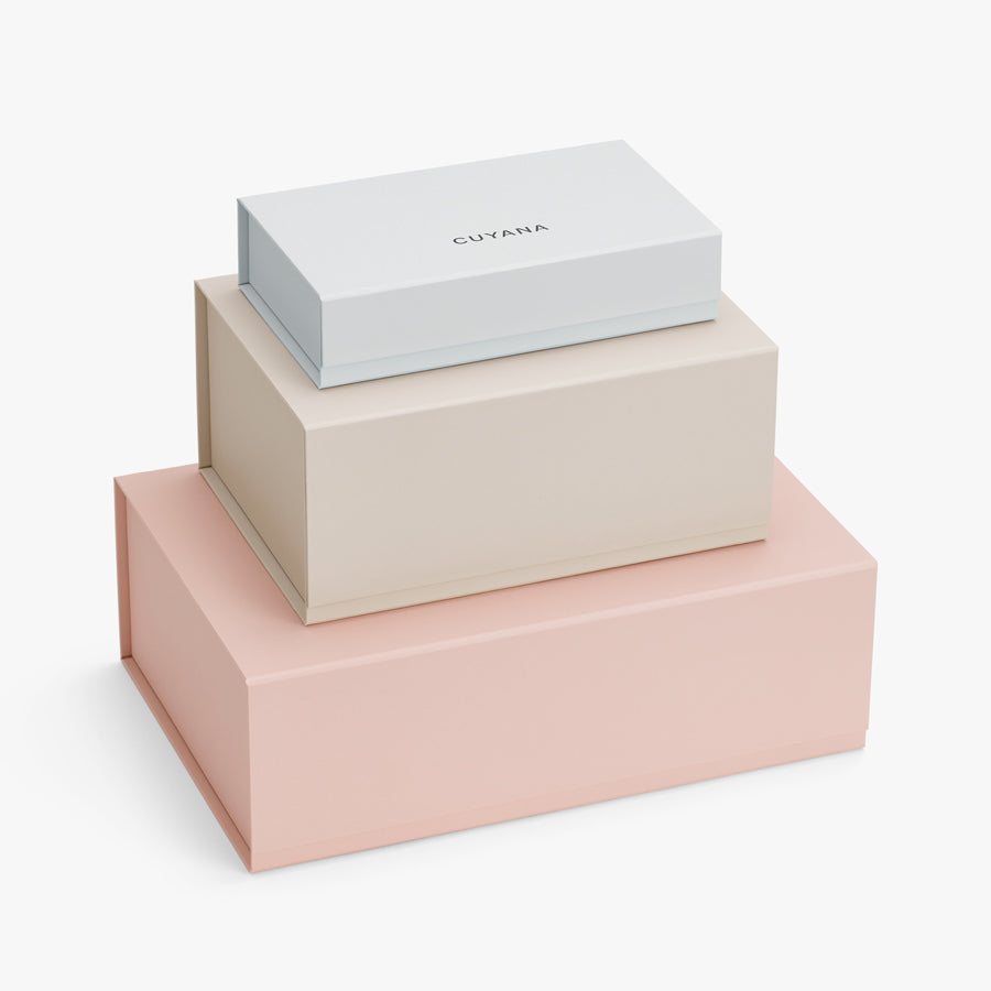 Three stacked gift boxes of varying sizes.