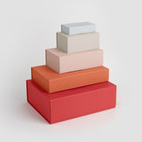 Stack of five boxes of different sizes arranged in ascending order.