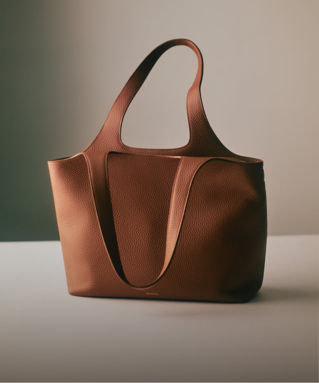 A tote bag on a plain surface.