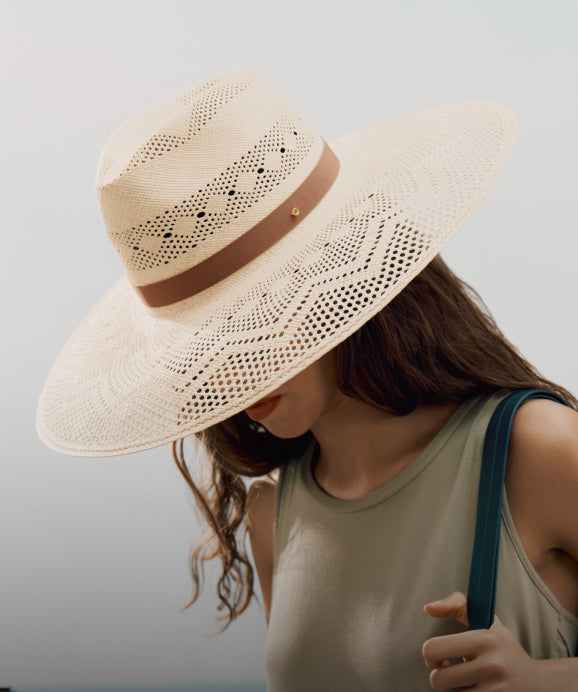 Model wearing woven straw hat. Linked image.