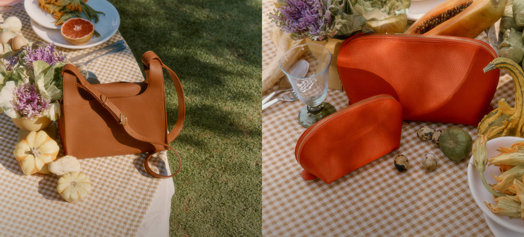 Left: brown leather shoulder bag next to produce and greenery. Right: Red/orange leather pouched next to produce and greenery. 