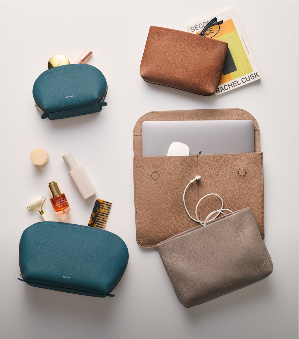 Assorted pouches and tech accessories on a flat surface.